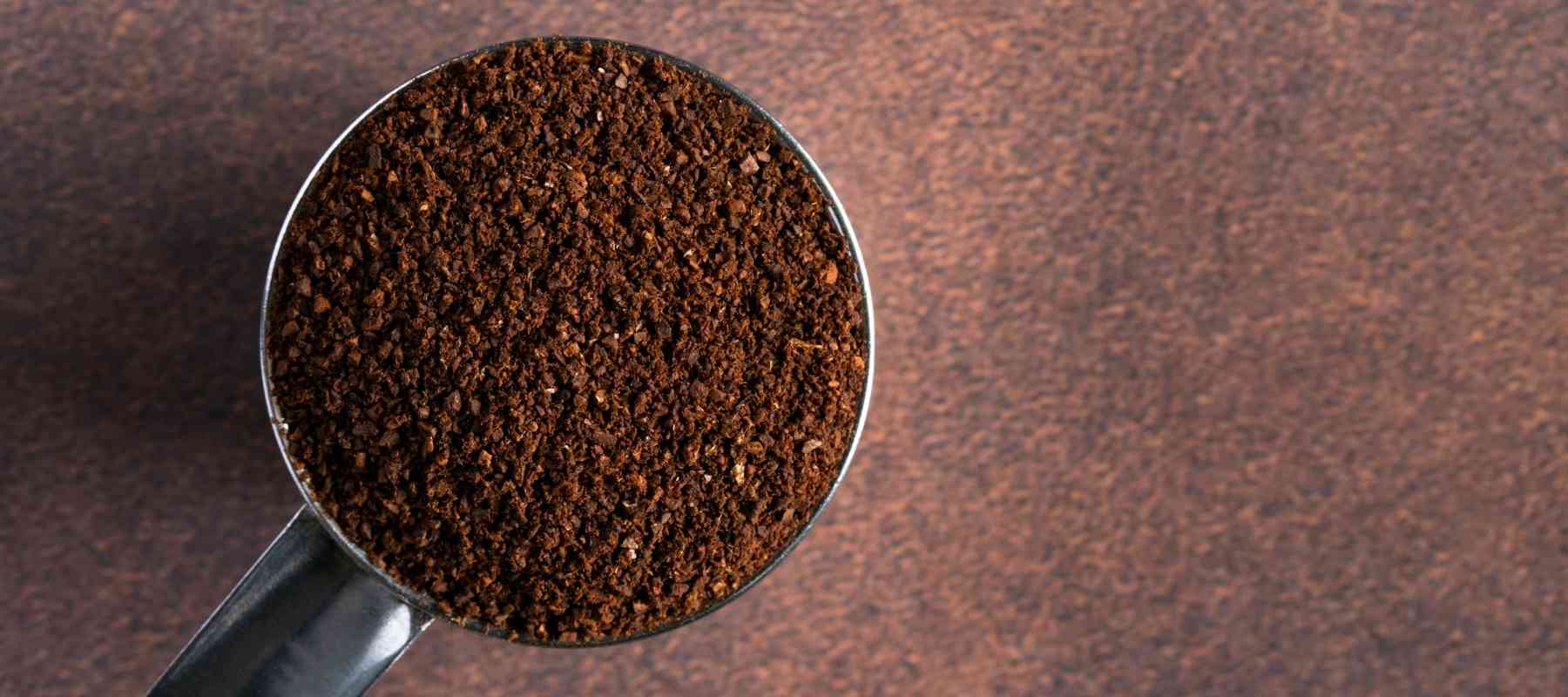 Dancing Moon Coffee® Ready to Brew ground coffee — a scoop of fresh, rich grounds, perfect for brewing at home.